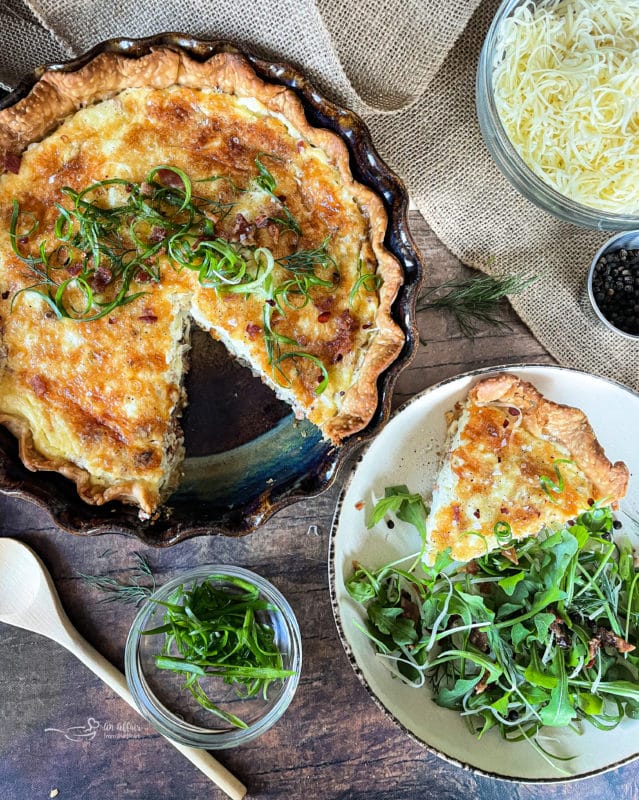 overhead of Bacon & Swiss Quiche slice on a plate with a salad