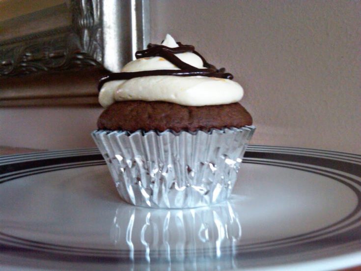 Side view of Double Chocolate Orange Cupcakes with Orange Butter Cream Frosting