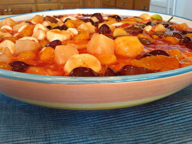 Side view of fruit salad in a multi colored bowl