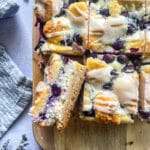 slice blueberry lemon crumb bar filled with cheesecake filling