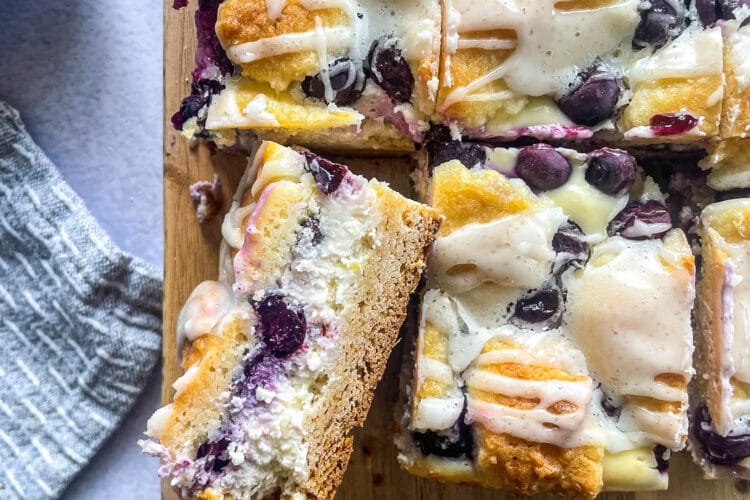 slice blueberry lemon crumb bar filled with cheesecake filling