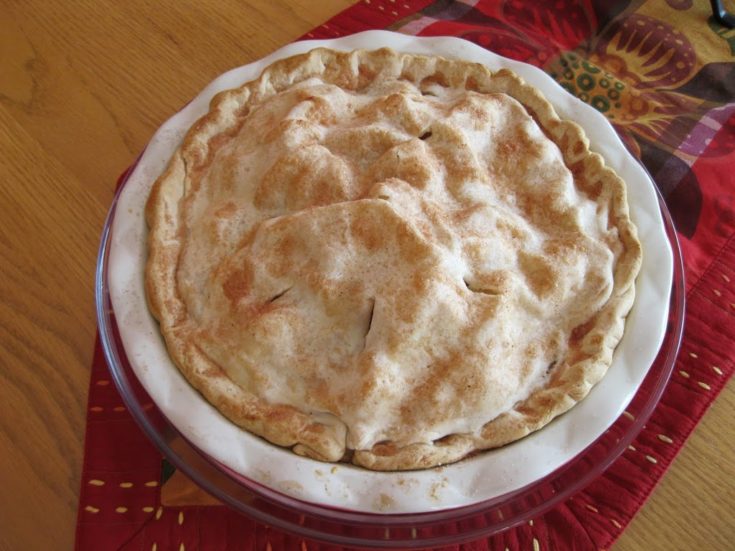 Overhead of apple pear pie in a white pie dish