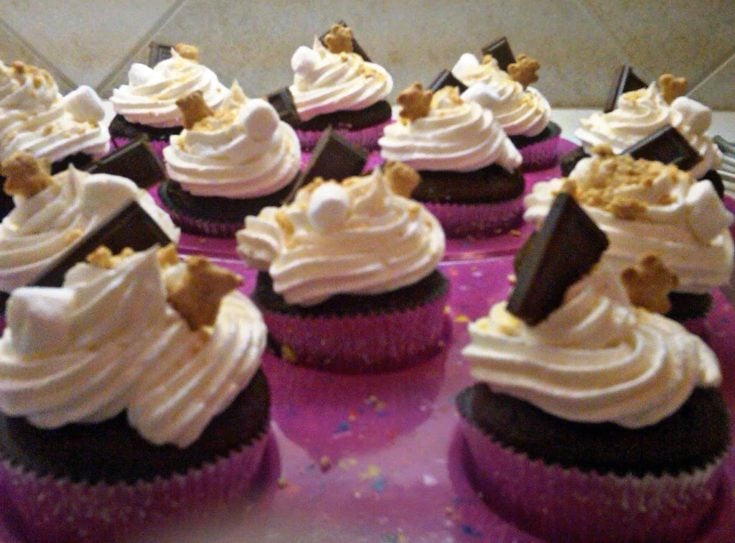 s'more cupcakes in a pink cupcake tray