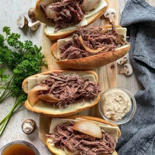 top view of four french dip sandwiches