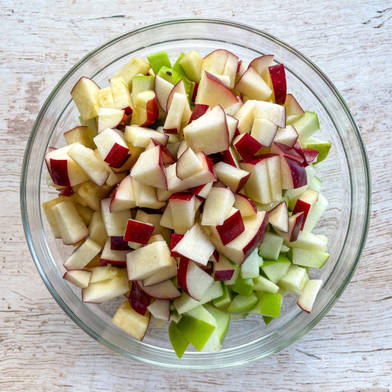 diced apples in glass bowl