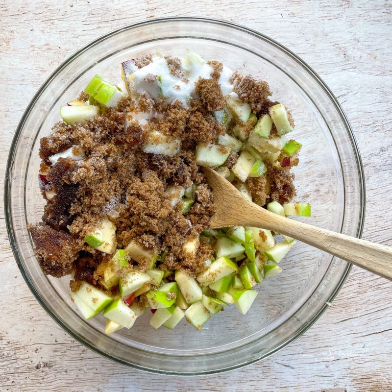 diced apples with sugar in bowl