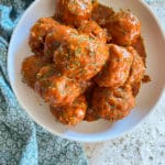 bowl of porcupine meatball with tomato sauce
