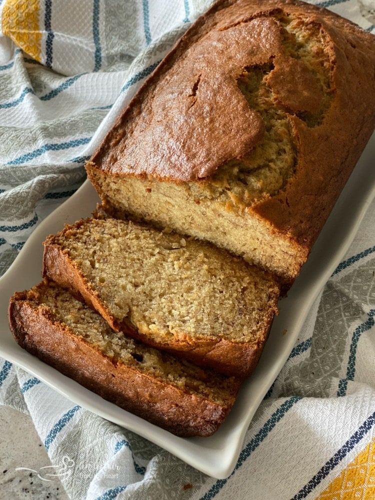 overhead of The BEST Banana Bread on a white platter