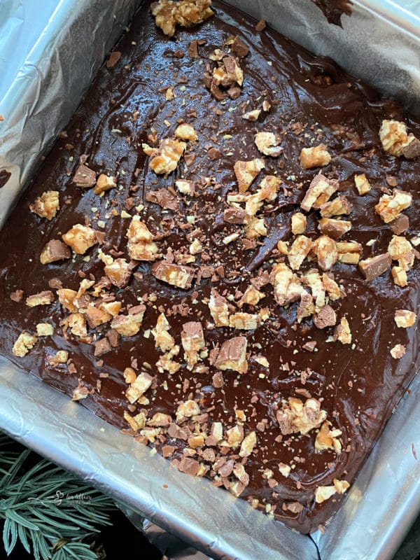 hot candy bar fudge in a bake pan