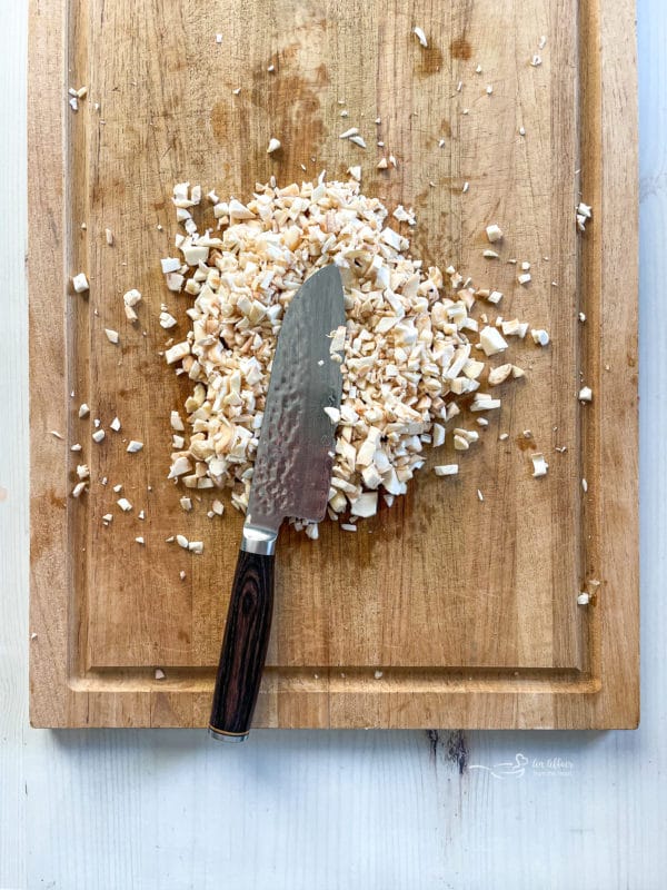 chopped mushroom stems on cutting board