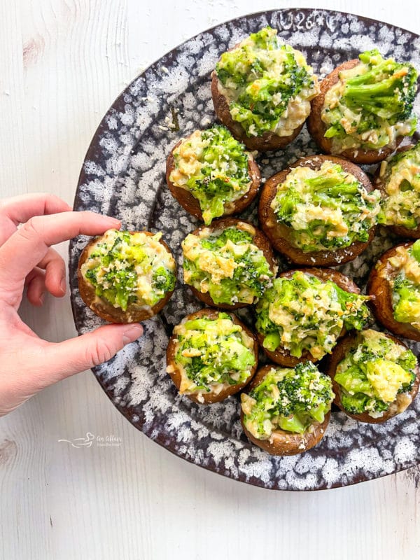 one plate of mushrooms with broccoli and cheese