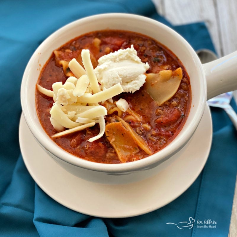 overhead of Easiest Lasagna Soup in a white bowl blue background