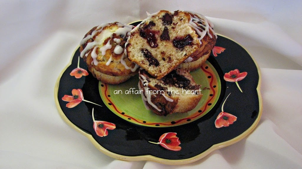 Chocolate Chip Raspberry Muffins on a multii colored plate