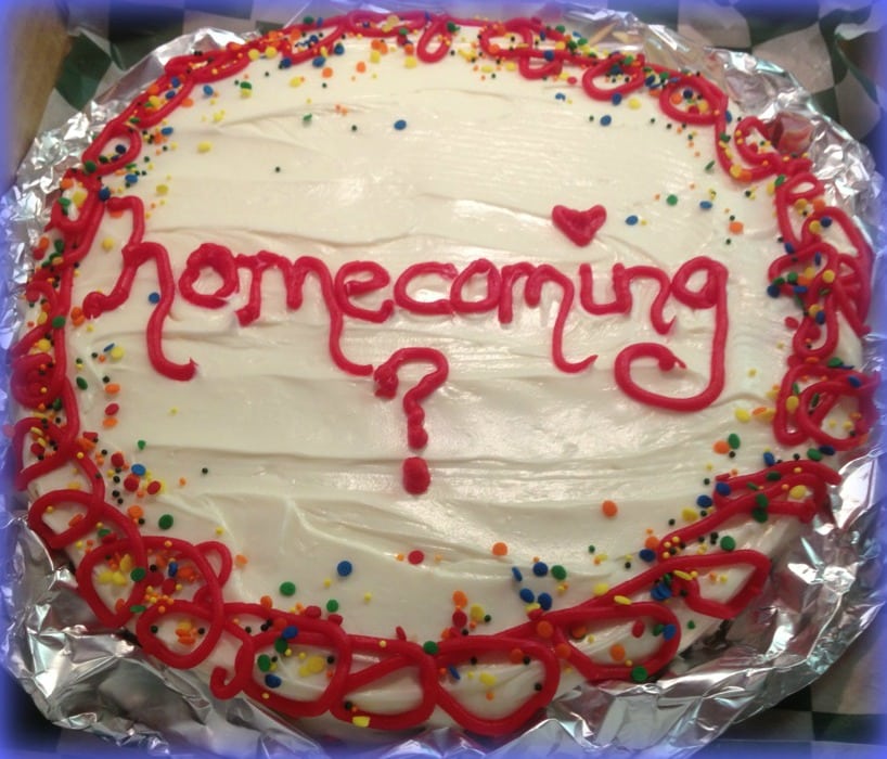 Overhead of cookie with writing on it that says "homecoming?"