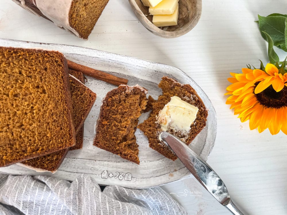 melted butter on sliced pumpkin bread