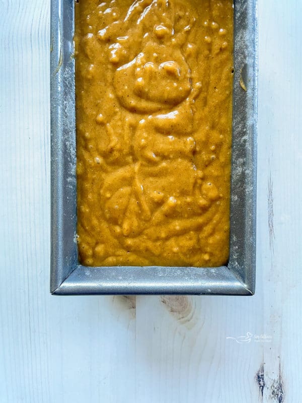 uncooked pumpkin bread in loaf pan