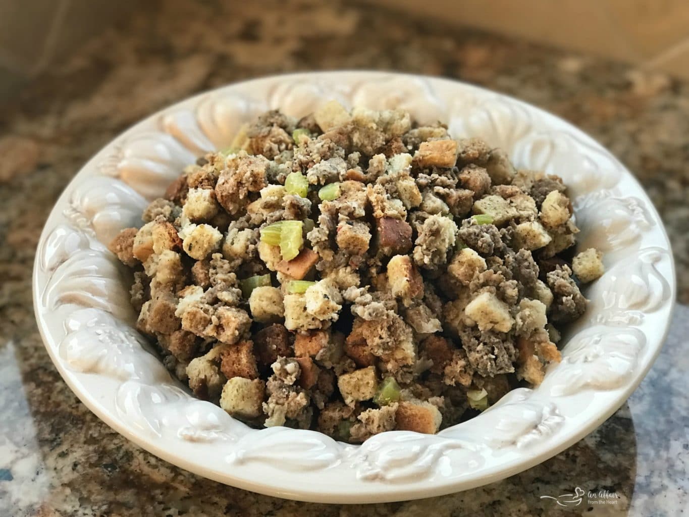 Mom's Sausage & Sage Dressing in a white serving bowl