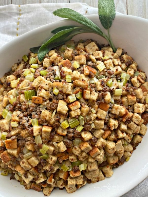 overhead of Mom's Sausage & Sage Dressing in a white serving bowl