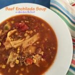 beef enchilada soup in a white bowl with text "beef enchilada soup"