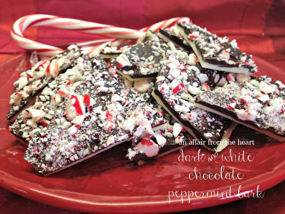 Side view of peppermint bark on a red plate with candy canes and text "dark and white chocolate peppermint bark"