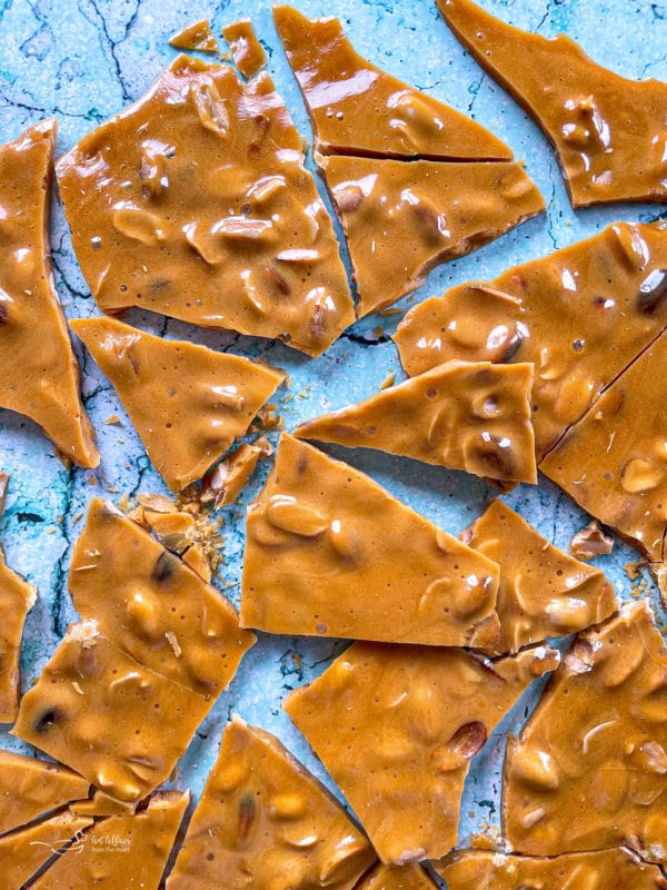 peanut brittle cracked on a marble surface