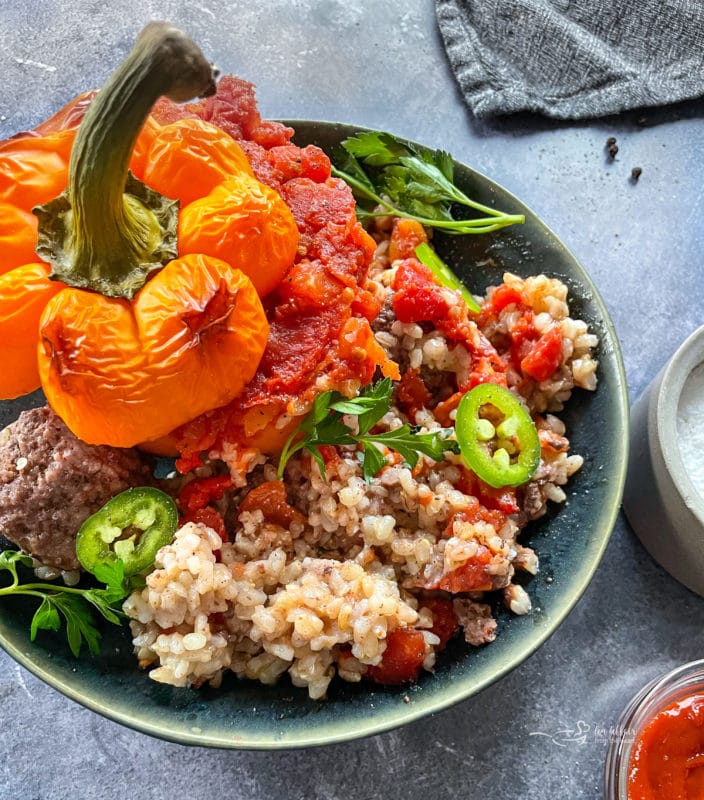 One bowl filled with stuffed peppers