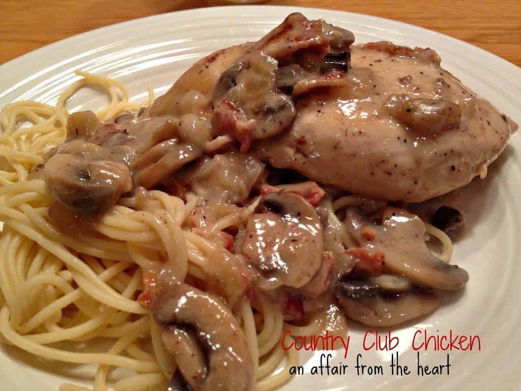 close up of country club chicken on a white plate with text "country club chicken"