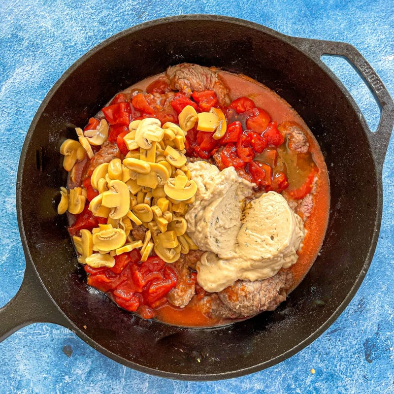 Top view of pepper steak being cooked in pan