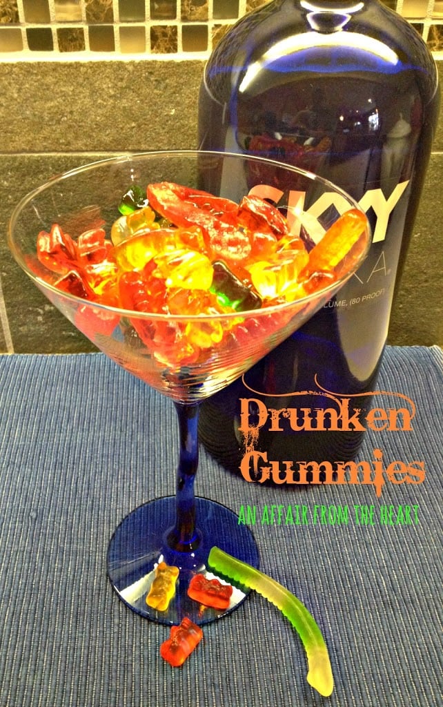 a martini glass with gummies in it and a bottle of Sky Vodka with text "drunken gummies"