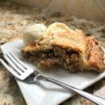 Grandma's Rhubarb Pie on a white plate with a fork