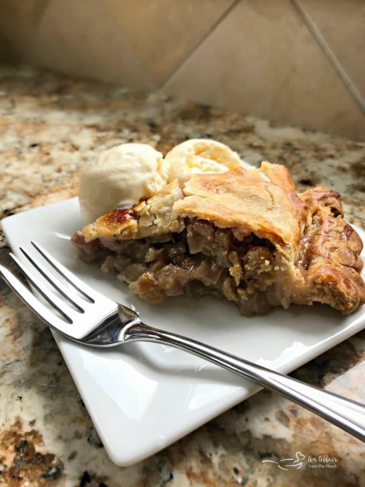 Grandma's Rhubarb Pie on a white plate with a fork