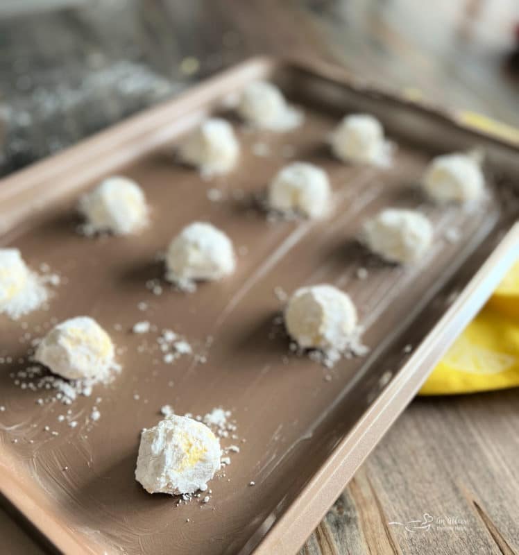 powdered sugar coated lemon whippersnappers ready to bake