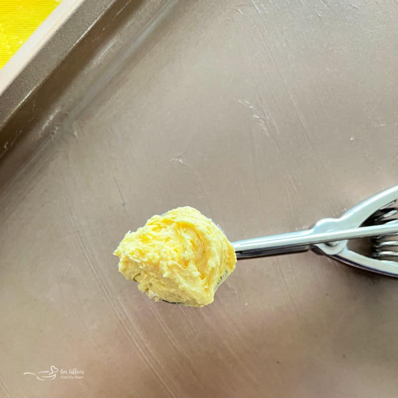 Measuring balls of lemon crinkle cookie dough