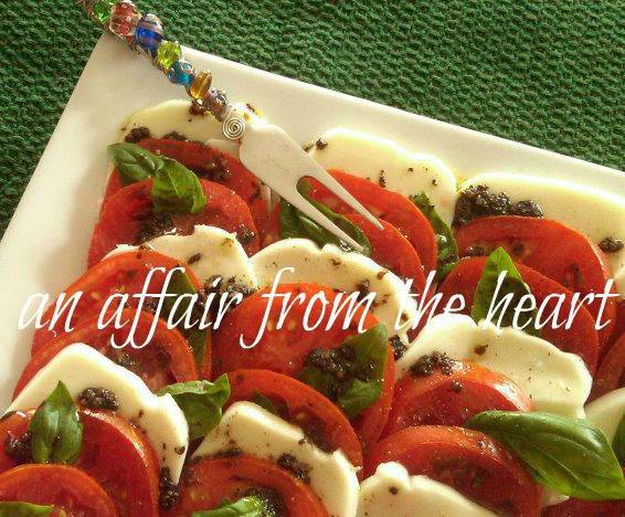 Close up of mozzarella and tomatoes on a white platter