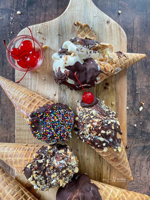 A group of homemade drumsticks with sprinkles and nuts