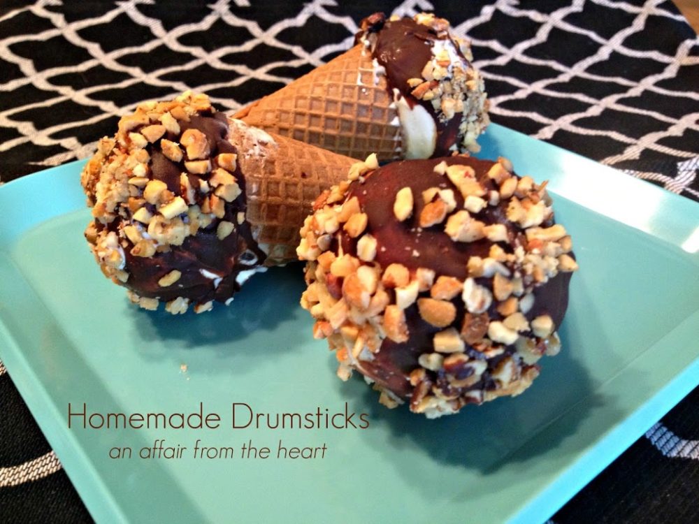 close up of homemade drumsticks on a blue plate with text "homemade drumsticks"