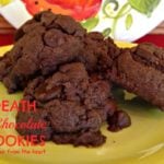 Close up of cookies on a yellow plate with text "Death by chocolate cookies"