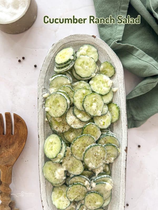 Close up of cucumber Ranch Salad on a white serving dish.
