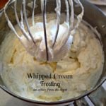 Whipped cream frosting in a mixer with text "whipped cream frosting"
