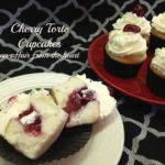 Cherry torte cupcake cut in half on a white plate and others on a red plate and text "cherry torte cupcakes"