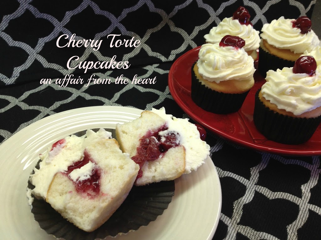 Cherry torte cupcake cut in half on a white plate and others on a red plate and text "cherry torte cupcakes"