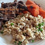Roast, rice and carrots on a white plate