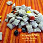 Pumpkin Spice Muddy Buddies on a striped table cloth