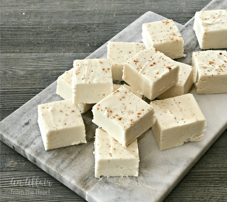 Eggnog Fudge stacked on a marble cutting board