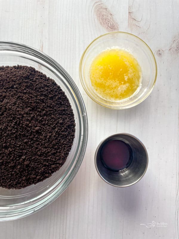 Oreo crumbs, butter, and vanilla in bowls