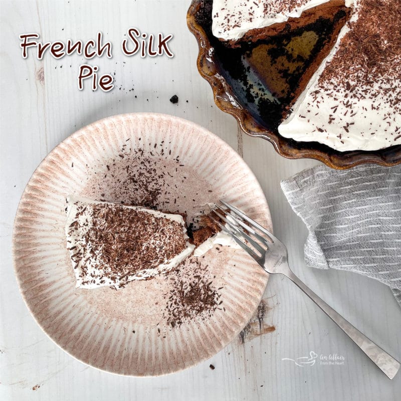 top view of French silk pie on plate with fork and chocolate curls