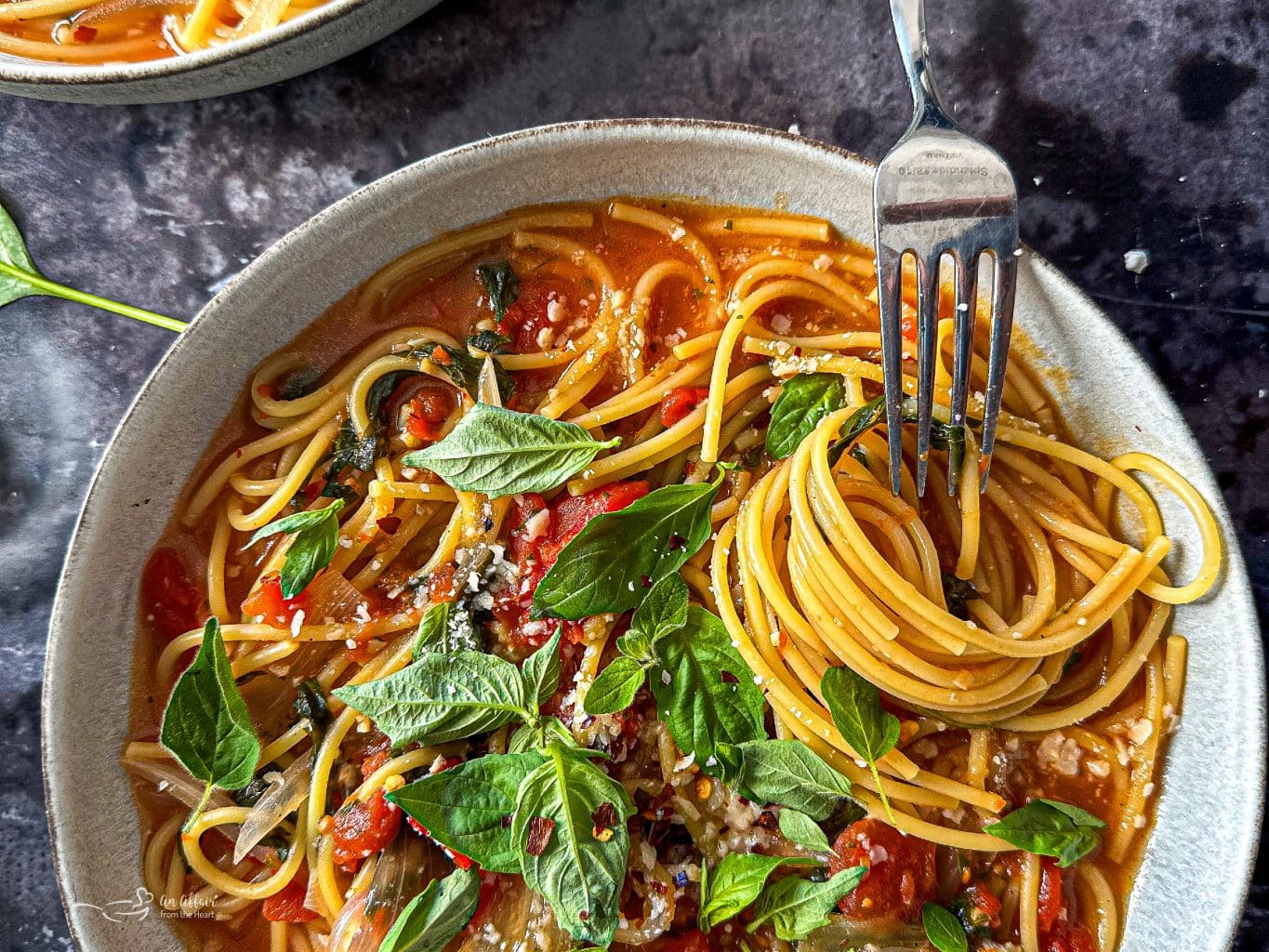 Close up of a fork twirling the pasta in a bowl of Italian Wonder Pot.