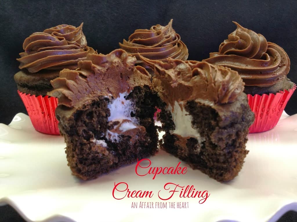 a chocolate cupcake cut in half so you can see the cream filling and text "cupcake cream filing"