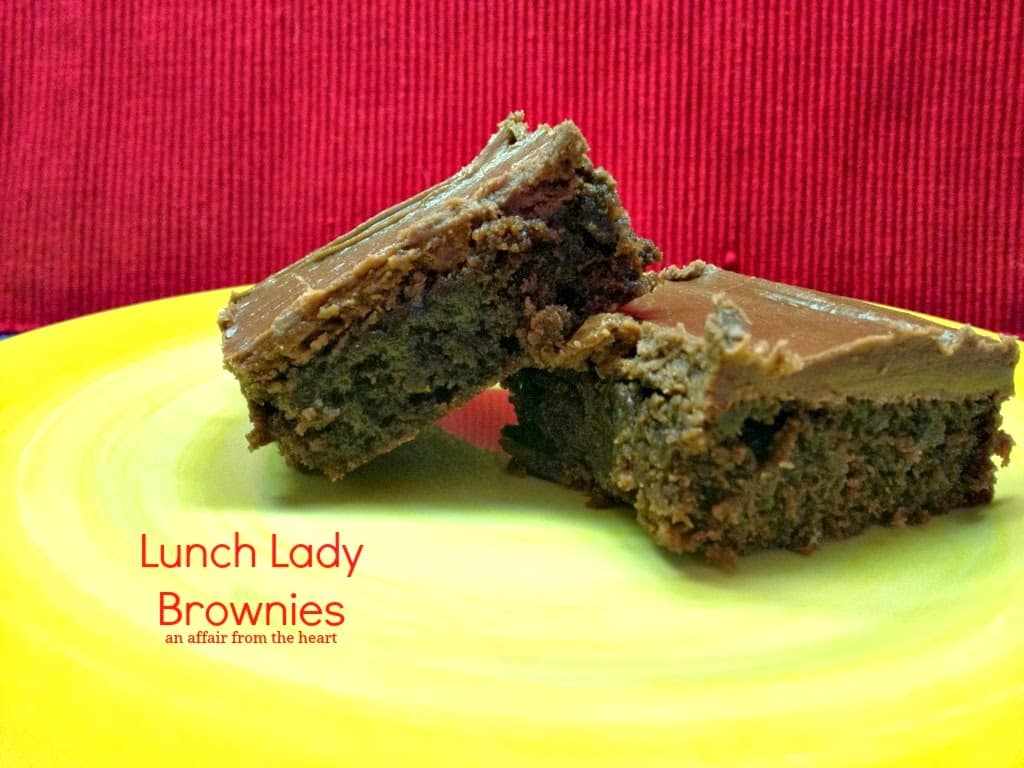 Brownies on a yellow plate with text "lunch lady brownies"