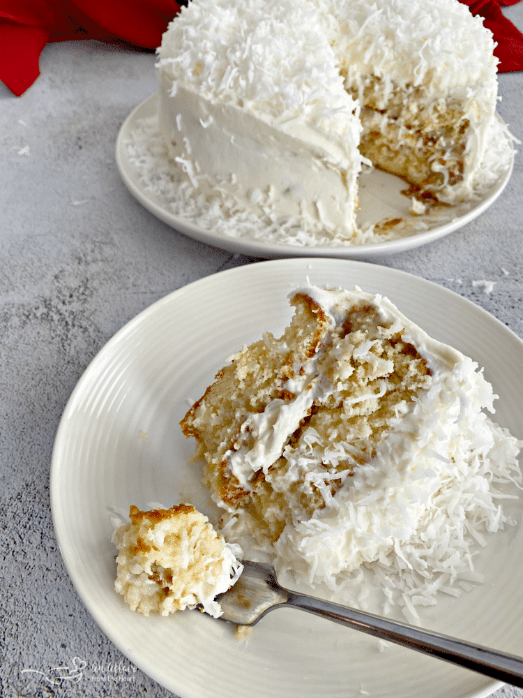 Coconut Cream Poke Cake with Coconut Whipped Cream Frosting